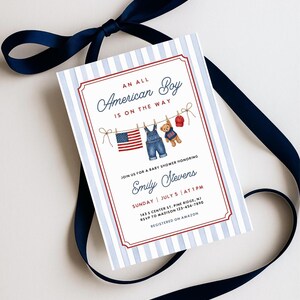May include: Baby shower invitation with a patriotic theme. The invitation features a red and white striped border, blue and white striped background, and the text "An American Boy is on the Way." Includes an American flag, overalls, and a teddy bear.