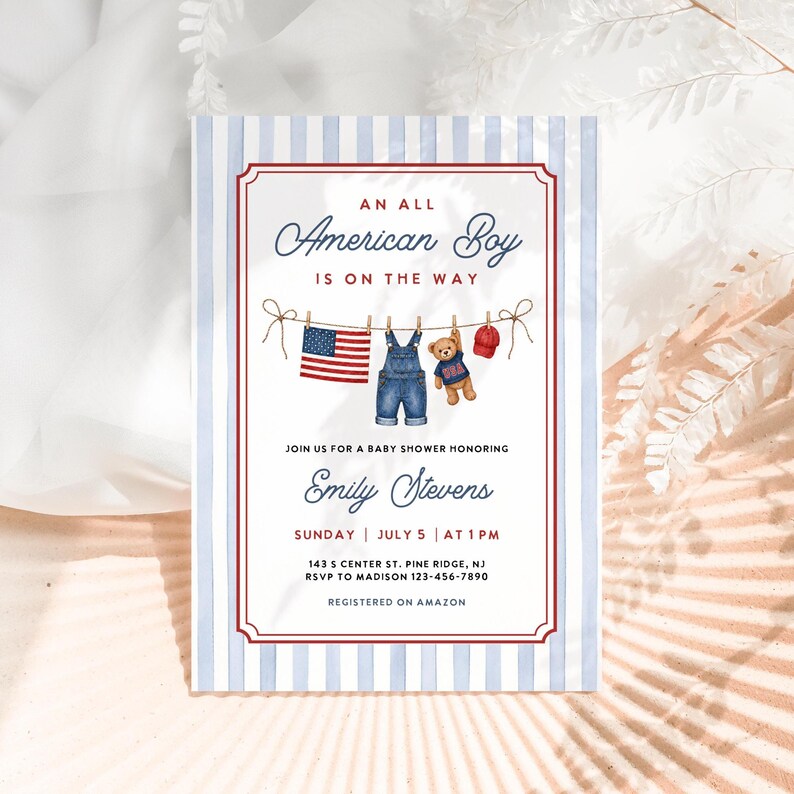 May include: Baby shower invitation with a patriotic theme. The invitation features a red and blue striped border and the text "An All American Boy Is On The Way." The design includes a clothesline with a small American flag, denim overalls, a teddy bear, and a baseball cap.