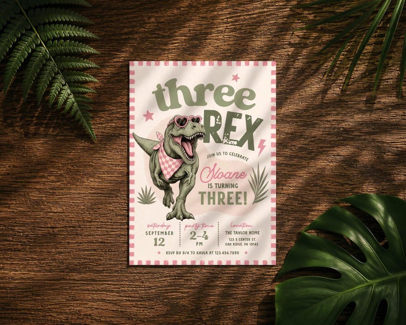 May include: A rectangular birthday invitation card featuring a green T-Rex wearing heart-shaped sunglasses and a pink checkered bandana. The text reads: three REX, join us to celebrate Sloane is turning THREE, Saturday September 12, 2-4 PM, The Taylor Home.