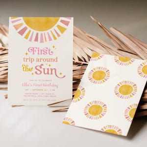 May include: Two invitations with a sun theme. One invitation reads "First trip around the Sun" in pink and yellow. The other invitation has a pattern of yellow and pink suns on a white background. The invitations are for Ella's First Birthday.