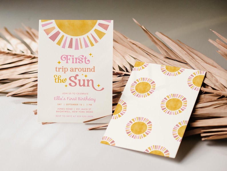 May include: Two invitations with a sun theme. One invitation reads "First trip around the Sun" in pink and yellow. The other invitation has a pattern of yellow and pink suns on a white background. The invitations are for Ella's First Birthday.