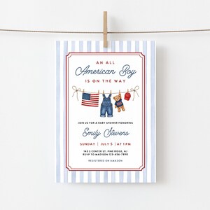 May include: Baby shower invitation with a patriotic theme. The invitation features the text "An All American Boy is on the Way" in elegant script. The design includes a clothesline with a miniature American flag, denim overalls, a teddy bear, and a red cap.
