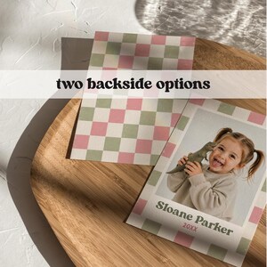 May include: Two rectangular cards featuring a pink and sage green checkered pattern. One card displays a photograph of a child holding a toy dinosaur, with the text "Sloane Parker" and "20XX" printed below. The text "two backside options" is visible.