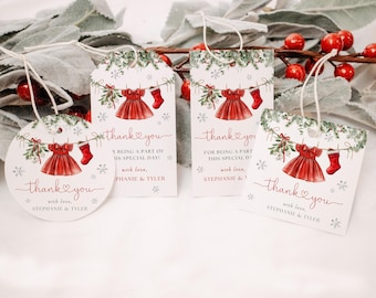 May include: Set of four Christmas-themed gift tags with a red dress and stocking design. Each tag features the words "thank you" and additional text. The tags are in various shapes: round, rectangular, and square.