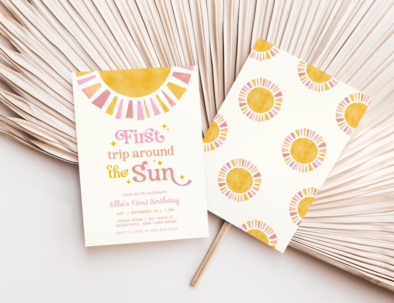 May include: Two invitations with a sun theme. One invitation has the text "First trip around the Sun" with event details. The other invitation has a repeating sun pattern. The suns are yellow and pink on a white background.