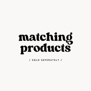 May include: A graphic design on a white background featuring the black text matching products in a bold, rounded serif font, with the smaller black text / SOLD SEPERATELY / centered directly underneath in a simple, clean sans-serif typeface.
