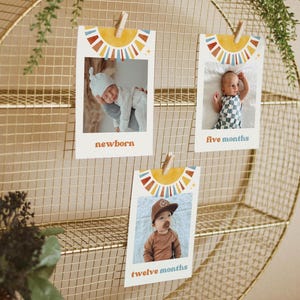 May include: Three colorful photo cards with a sunburst design and a baby's photo in each. The cards are labeled "newborn", "five months", and "twelve months".
