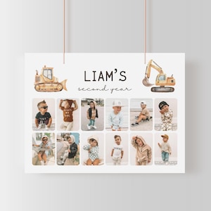 May include: A white poster featuring the text "LIAM'S second year" and photographs of a child. Watercolour illustrations of a bulldozer and excavator are at the top. The poster is suspended from a thin, brown string.