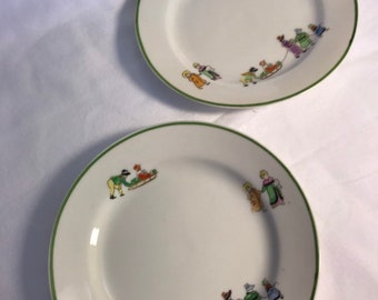 Two Hand Painted Plates with Victorian Style Children in Bonnets Pulling Sleds