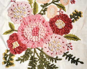 Embroidered square, yarn flowers