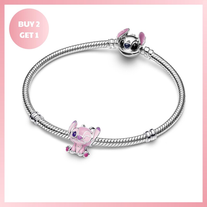 A silver bracelet with a charm featuring a pink elephant and a silver Stitch character.