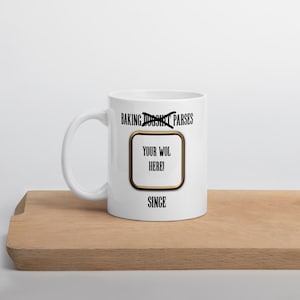 May include: White ceramic mug with a handle, featuring the text "BAKING DOESN'T PARSE" crossed out, and "YOUR WOL HERE!" inside a gold-bordered rectangle. The word "SINCE" is below the rectangle.