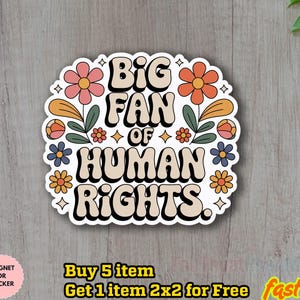 May include: A sticker with the text "BIG FAN OF HUMAN RIGHTS" in a retro font, surrounded by colorful flowers and leaves. The sticker is white with a black outline and is on a wooden surface. The sticker is a magnet or sticker.