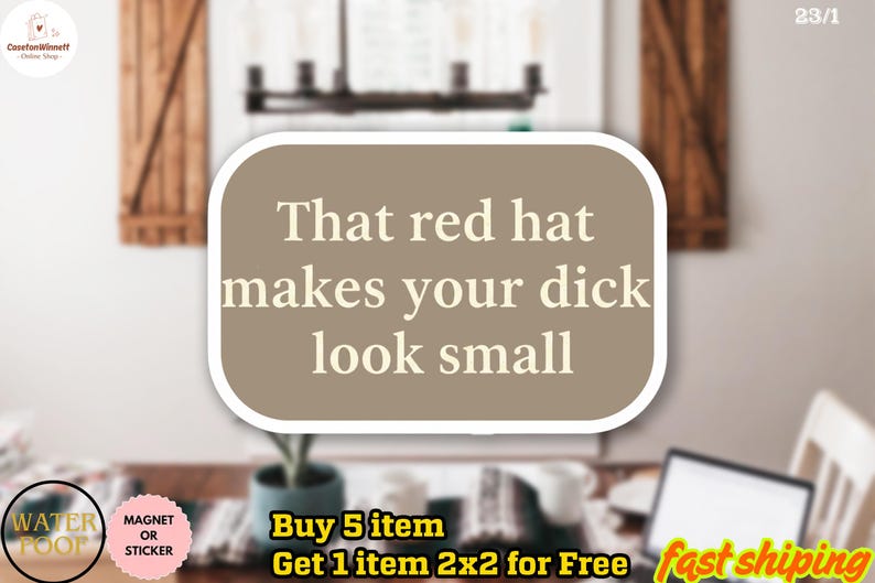May include: A sticker with the text "That red hat makes your dick look small" in a white font on a brown background. The sticker is a magnet or sticker.