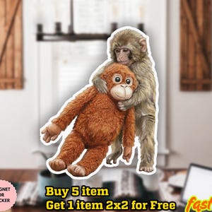 May include: A sticker or magnet featuring two monkeys. One is a light brown orangutan-like monkey being embraced by a smaller, gray monkey. The sticker has a white border and the text "WATER POOP" and "MAGNET OR STICKER".