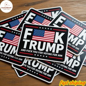May include: A collection of black and white stickers with the text "F Trump" and an American flag design. The stickers also include the phrase "And Fuck You For Voting For Him".