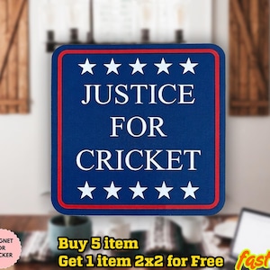May include: A blue square magnet or sticker with a red border and white text that reads "JUSTICE FOR CRICKET". The design includes white stars at the top and bottom. The product is waterproof.