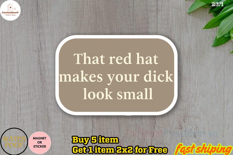 May include: A sticker or magnet with a tan background and white border. The text "That red hat makes your dick look small" is printed in a bold, sans-serif font. The sticker has a rounded rectangle shape.