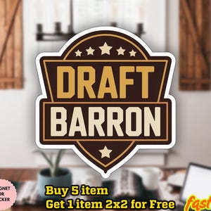 May include: A sticker with the text "DRAFT BARRON" in a brown and gold design. The sticker has a shield shape with stars and a star. The word "WATERPROOF" is in a circle at the bottom left.