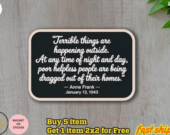 May include: A black rectangular magnet or sticker with rounded corners, featuring a quote by Anne Frank in white script: "Terrible things are happening outside." The quote is set against a black background with a cream border.