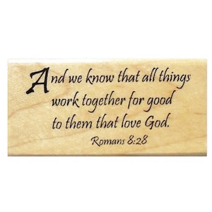 May include: Wooden stamp with the text "And we know that all things work together for good to them that love God. Romans 8:28"