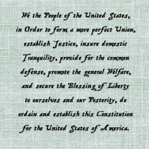 May include: A black and white image of the Preamble to the United States Constitution, written in a cursive font on a textured background.