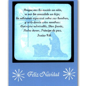 May include: A blue Christmas card with a white snowflake design and the text "Feliz Navidad". The card features a silhouette of the nativity scene with the text "Porque nos ha nacido un ni&ntilde;o, se nos ha concedido un hijo; la soberan&iacute;a reposar&aacute; sobre sus hombros, y se le dar&aacute;n estos nombres: Consejero admirable, Dios fuerte, Padre eterno, Pr&iacute;ncipe de paz. Isa&iacute;as 9:6"