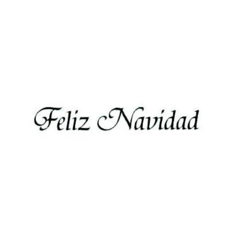 May include: A black and white image with the text "Feliz Navidad" in a cursive font.