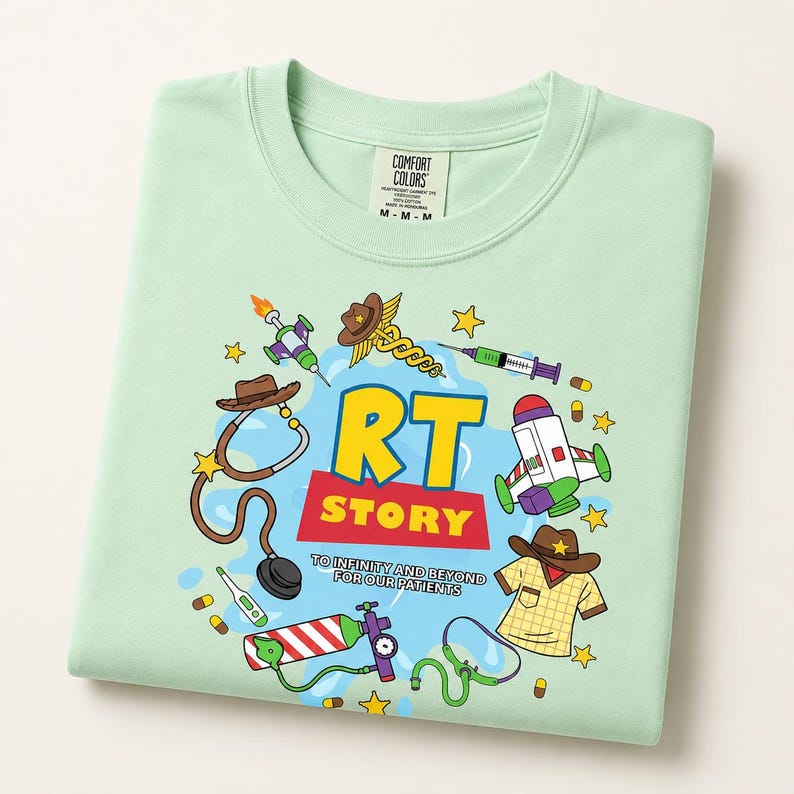 May include: A light green t-shirt featuring a graphic print with the text RT STORY TO INFINITY AND BEYOND FOR OUR PATIENTS. The design includes medical and space-themed illustrations like a stethoscope, syringe, oxygen tank, and cowboy hat.