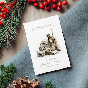 May include: A Christmas program with the text "OH HOLY NIGHT" and "Christmas Program December 3rd 2023". The program features an illustration of the Nativity scene with Mary, Joseph, baby Jesus, and sheep. The program is on a white card.
