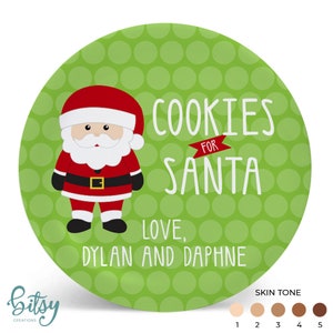 May include: Green ceramic plate with white polka dots, a cartoon Santa Claus, and the text "Cookies for Santa Love, Dylan and Daphne".