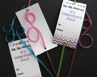 May include: Three Valentine's Day gift tags with pink, blue, and green straws attached. The tags have a chevron pattern and say "Sip, Sip, Hooray! It's Valentine's Day!" and "Sip, Sip, Hooray! It's Valentine Day!"