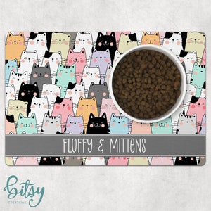 Cat Food Mat - Cute Cartoon Cat Faces Pastel Colors - Personalized With Cat's Name - Machine Washable Fabric Top with No-Slip Neoprene Back
