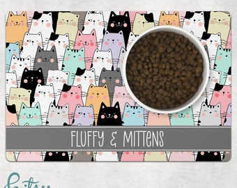 Cat Food Mat - Cute Cartoon Cat Faces Pastel Colors - Personalized With Cat's Name - Machine Washable Fabric Top with No-Slip Neoprene Back