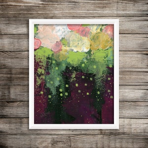 May include: Abstract floral art print in a white frame. The painting features a mix of colours, including pink, yellow, green, and deep purple. The artwork has a textured appearance with visible brushstrokes, creating a vibrant and expressive piece.