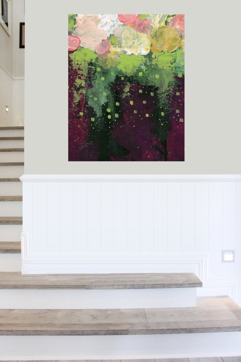 May include: Abstract floral painting with a textured finish. The artwork features a blend of colours, including pink, yellow, green, and deep purple. The painting is mounted on a wall above a white panel and wooden stairs.