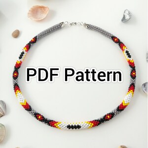 May include: A circular beaded necklace featuring a pattern of red, yellow, white, and black beads. The necklace has a silver clasp. The text "PDF Pattern" is displayed in the centre of the image.