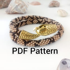 May include: A beaded bracelet with a snake design. The bracelet is made of tan and brown beads and features a gold-colored snake head clasp. The text "PDF Pattern" is displayed below the bracelet.