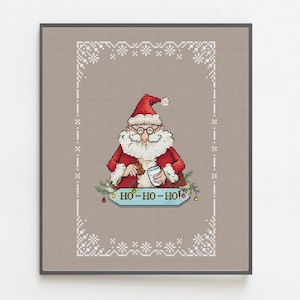 Patrón de punto de cruz de Papá Noel con marco de copo de nieve y la inscripción "Ho Ho Ho". Tarjeta navideña bordada a mano (descarga digital en PDF).