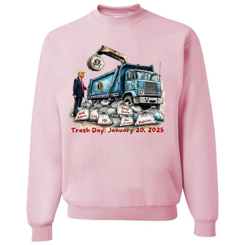 a pink sweatshirt with a picture of a dump truck