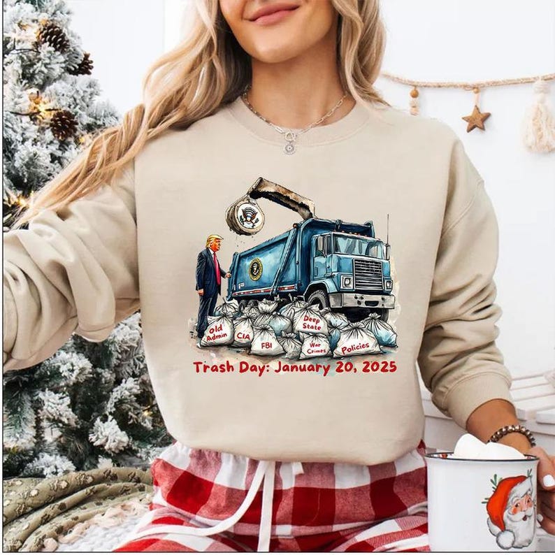 a woman wearing a sweatshirt with a truck on it