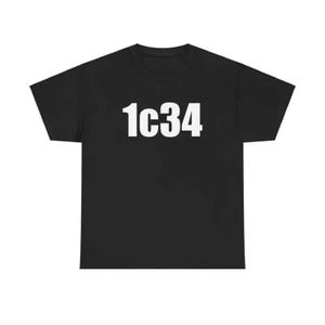 May include: Black t-shirt with the white text "1c34" printed across the chest. The short-sleeved shirt is made of a soft material and is suitable for casual wear.