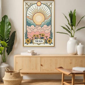 May include: A vintage-style illustration of the sun with a golden frame and floral accents. The text "THE SUN" is printed below the image.