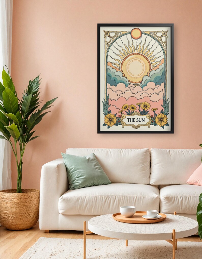 May include: A black framed print with a vintage illustration of the sun shining over clouds. The illustration is in a pastel color palette with yellow, pink, blue, and green. The text "THE SUN" is at the bottom of the print.