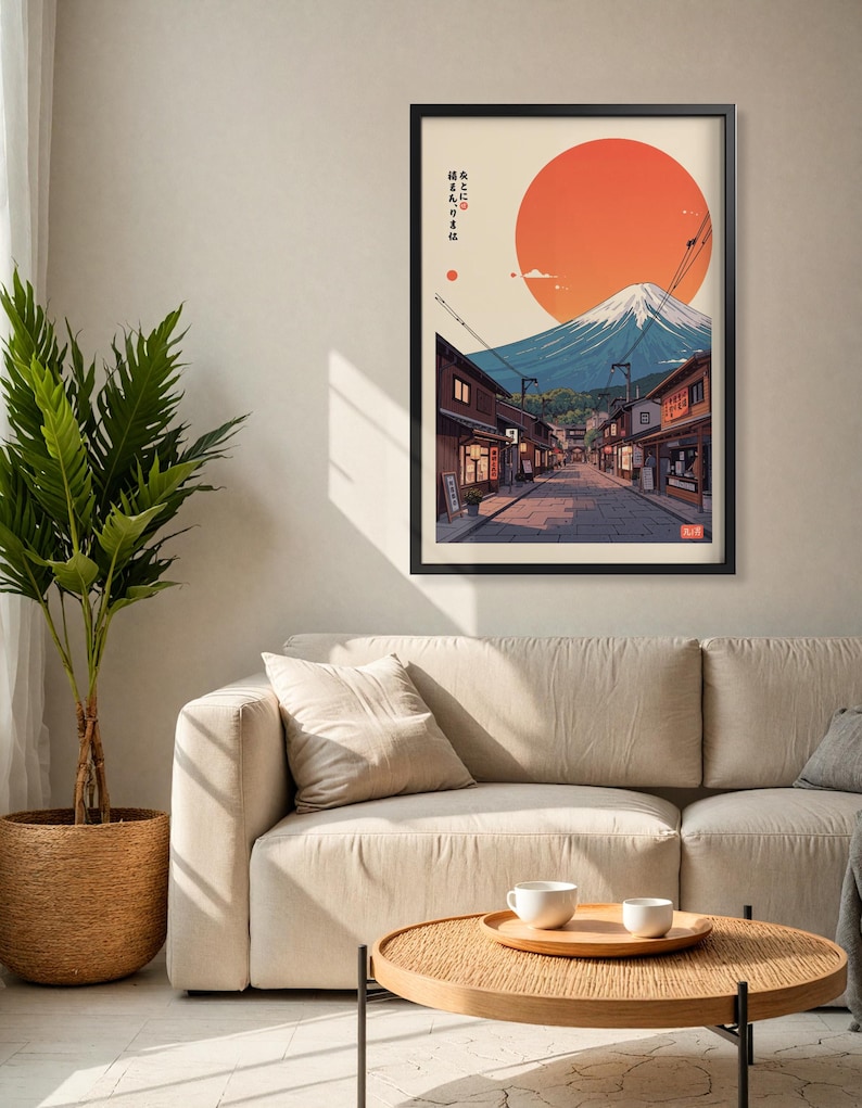 Pode incluir: Uma impress&atilde;o emoldurada de uma paisagem urbana japonesa com o Monte Fuji ao fundo. O sol se p&otilde;e atr&aacute;s da montanha, lan&ccedil;ando um brilho laranja quente sobre a cena. A impress&atilde;o apresenta texto japon&ecirc;s que diz "ここに住みたい", que se traduz como "Quero morar aqui".