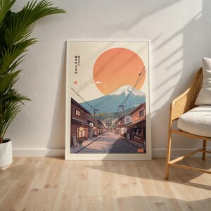 Pode incluir: Uma ilustra&ccedil;&atilde;o digital de uma cena de rua japonesa com o Monte Fuji ao fundo. O c&eacute;u &eacute; laranja e o sol est&aacute; se pondo. O texto na imagem diz "自然とともに生きる は  自然と生きる は"