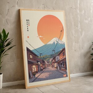 Pode incluir: Uma ilustra&ccedil;&atilde;o digital do Monte Fuji com um sol vermelho ao fundo. A montanha &eacute; cercada por uma pequena cidade com edif&iacute;cios tradicionais japoneses. O texto "友と心に  寄り添う は  " est&aacute; escrito em japon&ecirc;s no lado esquerdo da imagem.
