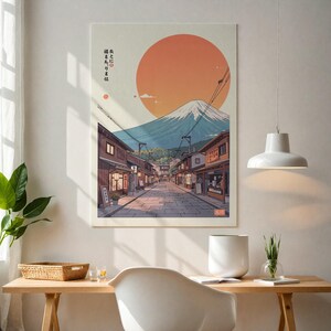 Pode incluir: Uma ilustra&ccedil;&atilde;o colorida de uma cena de rua japonesa com o Monte Fuji ao fundo. A rua &eacute; ladeada por edif&iacute;cios tradicionais e um sol vermelho est&aacute; no c&eacute;u. O texto na imagem diz "街を歩くには", que se traduz como "Para caminhar pela cidade".