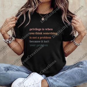 May include: Black t-shirt with the text "privilege is when you think something is not a problem because it isn't your problem" in pink, orange, and blue. The shirt is worn by a person.