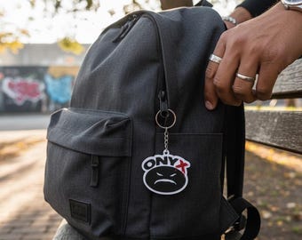 ONYX Angry Face Keychain – Cartoon Street Style Charm – Backpack Accessory – Black & White Key Ring